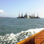 Cargo ship coming to land on the ocean.
