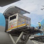 Cargo box being loaded on a plane.